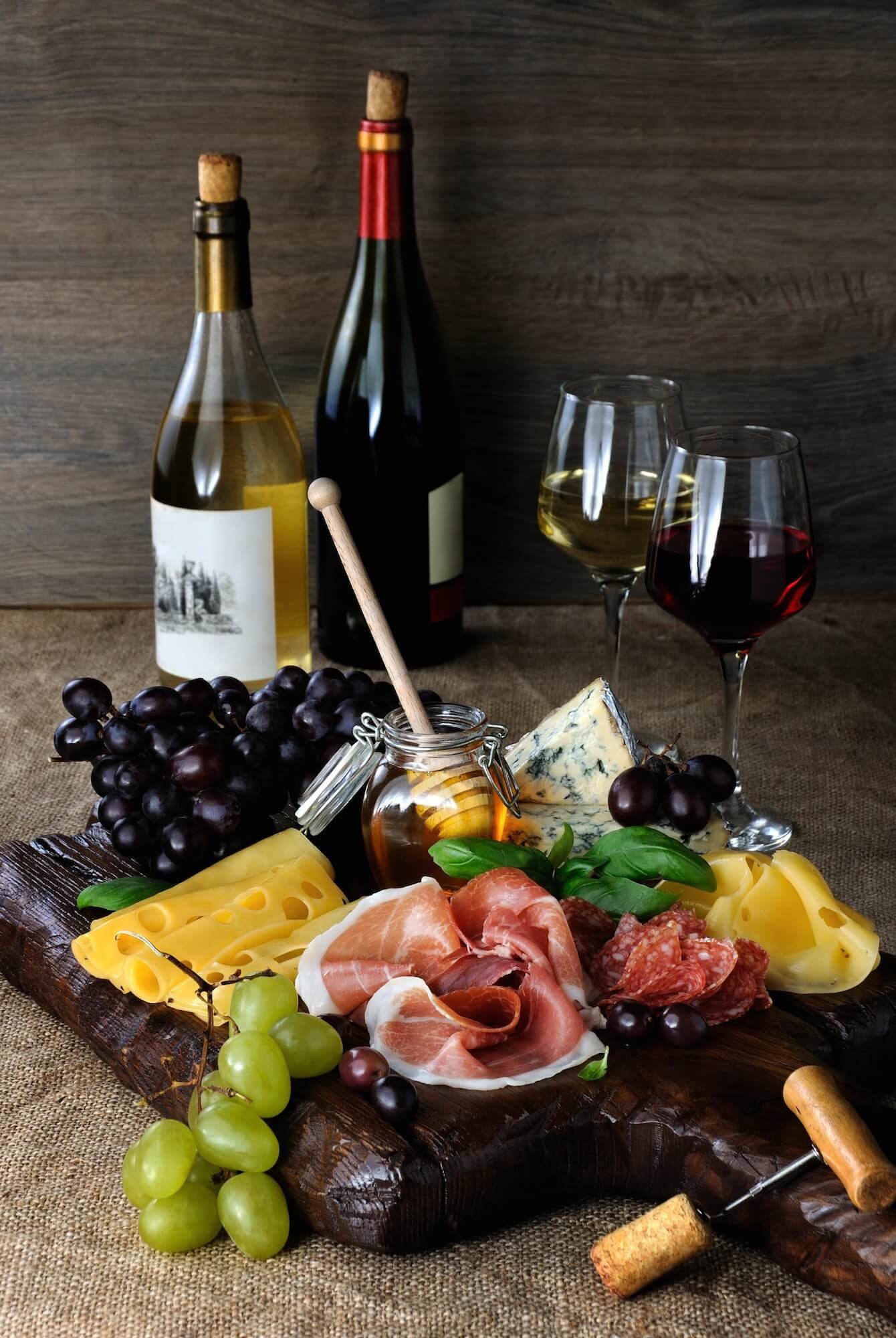 antipasto-catering-platter-with-jerky-bacon-prosciutto-salami-cheese-and-grapes.jpg