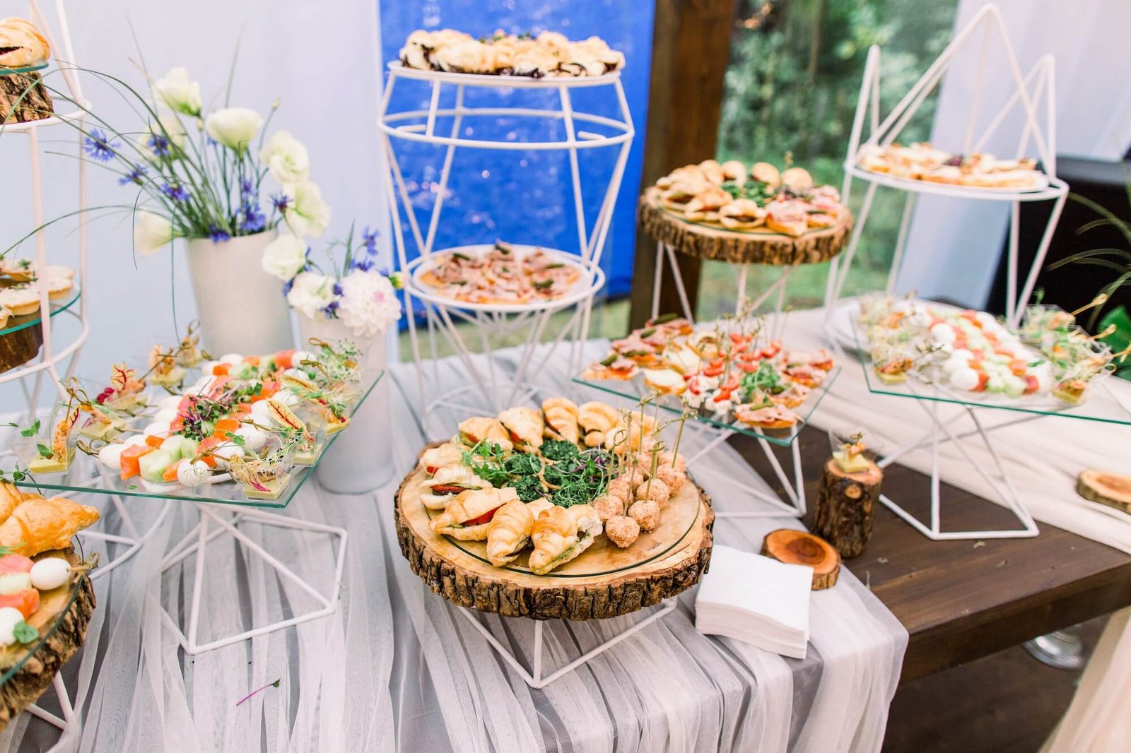 catering-buffet-and-rustic-decor-outdoor-wedding-party-with-healthy-food-snacks.jpg