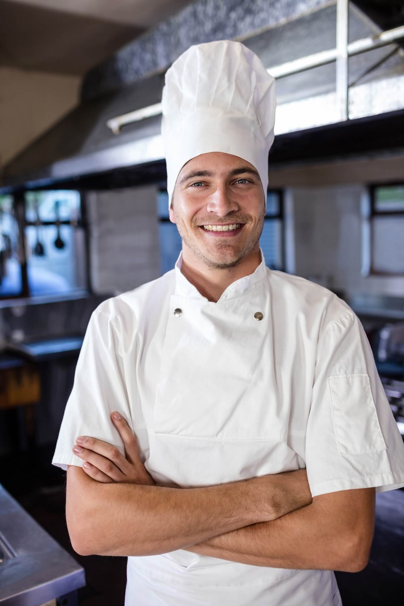 male-chef-standing-with-arms-crossed-in-kitchen.jpg